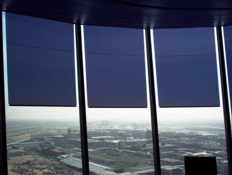 Glare protection with transparent film roller blinds at airport tower London Heathrow Glare protection with transparent film roller blinds at airport tower London Heathrow